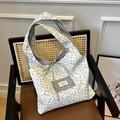 Borsa tote in tela con motivi floreali e a quadretti con dettaglio fiocco e logo - Nero