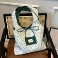 Borsa tote reversibile in tela a fiori con fodera a quadretti verdi e tasca frontale - Verde