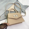 Beige faux leather trapezoid handbag with silver metal bow and detachable shoulder strap - Khaki