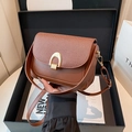 Brown faux leather crossbody bag with woven texture flap and gold U-shaped buckle - Brown