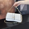 White vintage underarm bag with gold chain strap and elegant faux leather texture - White