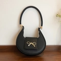 Chic black crescent underarm bag in cross-grain leather with a gold bow accent - Black