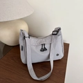 Light grey nylon tote bag with black triangle zipper pulls and adjustable shoulder strap - Gray