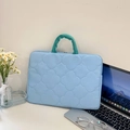 Light blue quilted laptop sleeve with clover pattern and green handles for 14-inch laptops - Horizontal Blue
