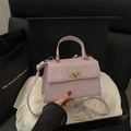 Elegant lavender sequined handbag with gold twist lock and a detachable shoulder strap - Pink