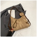 Detail of khaki canvas tote with brown leather straps and small detachable round pouch - Brown