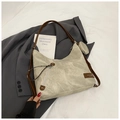 Detail of grey tote bag with brown leather straps, matte texture, and small round pouch - Khaki