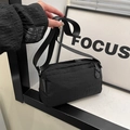 Chic black nylon crossbody bag with multiple zip pockets and adjustable strap - Black