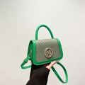 Vibrant green hand bag with woven pattern flap and golden M logo on white background - Green