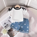 Flat lay of girl's white t-shirt with bows and embroidered denim shorts set - 90cm-3Y / White Bowknot Top with Blue Embroidered Denim Shorts (SH5033)
