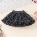 Close-up of dark grey tiered tulle tutu skirt with elastic waistband and mesh layers - Gray