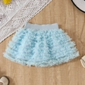 Light blue multi-layer girls tutu skirt with elastic waistband on wooden background - Blue