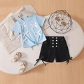 Flat lay of girl's blue bow t-shirt and black denim shorts with silver button details - 100cm / Blue