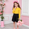 Dettaglio top giallo a maniche lunghe e gonna a pieghe nera glitterata per bambina - 90cm / Arancione
