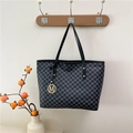 Deep grey tote bag with all-over M-letter pattern and golden metallic pendant charm - Black