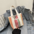 Colorful woven tote bag with vibrant diagonal stripes and white canvas handles - Style 1