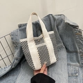 Small hand-held tote bag with bold black and white diagonal stripes and metal button - Style 4