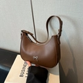 Brown half-moon hobo bag with silver metallic bow detail and adjustable shoulder strap - Brown