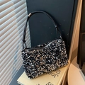 Chic black sequin shoulder bag with knot strap detail and metallic finish shine - Silver