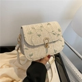 Chic woven saddle bag with floral embroidery and gold droplet clasp on white silk - White