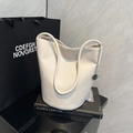 Minimalist off-white pebbled leather bucket bag with silver chain and long handle - White