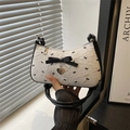 White seersucker underarm bag with black silk bow and silver heart pendant charm - White