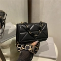 Black quilted crossbody bag with pyramid texture and dual stylish shoulder straps - Black