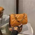 Caramel orange crossbody bag with geometric quilting and decorative thick chain - Brown