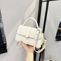 Chic cream white leather handbag with buckle detail and adjustable shoulder strap - White
