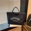 Borsa tote blu scuro con scritte bianche e manici in corda intrecciata per pendolari - Blu