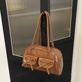 Brown vintage PU leather shoulder bag with ballet bows and dual front pockets - Brown