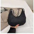 Detail of minimalist black crescent bag with glitter fabric and gold hardware adjustment - Black