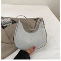 Detailed macro view of sparkling silver crescent hobo bag with metallic glitters - Silver