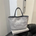 Gray nylon tote bag with white letter print and braided handles for daily commuting - Gray