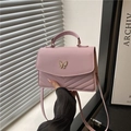 Pink quilted leather handbag with gold butterfly clasp and top handle for women - Pink