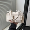 Chic beige Boston bag with lace bow accents and dual front pockets for women - White