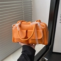 Fashionable bright orange Boston bag with white lace bows and twin front pockets - Orange