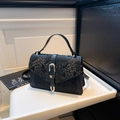 Vintage black crossbody bag with snakeskin texture and a gold U-shaped metal buckle - Black