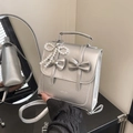Silver metallic bow handbag with pearl heart charm and mirror finish surface - With Pendant / Silver