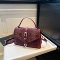 Retro burgundy snake embossed leather crossbody handbag with gold buckle and top handle - Red