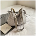 Detail of a large canvas tote bag with fringed layers and geometric patterned strap - Gray