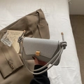 Borsa baguette donna grigio chiaro con patta intrecciata argento e tracolla a nodi - Argento