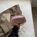 Mini pink pebble leather round clutch bag with gold C-ring handle and metal chain - Pink
