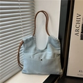 Minimalistische hellblaue Denim-Tragetasche mit braunen Seilgriffen und Metallknopf-Tasche - Hellblau