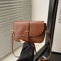 Brown vegetable tanned leather shoulder bag with gold buckle and adjustable strap - Brown