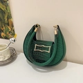 Dark green crocodile texture crescent hobo bag with gold hardware on a minimalist background - Green