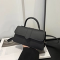 Minimalist black matte leather flap shoulder bag with top handle and vertical strap detail - Black