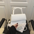 White faux leather crossbody square bag with unique double knot top handle and gold hardware - White