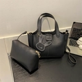 Classic black faux leather tote bag set with bunny pendant and gold hardware details - Black