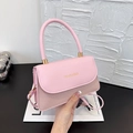 Pink patchwork crossbody bag with elegant leather handles and gold fashion lettering - Pink